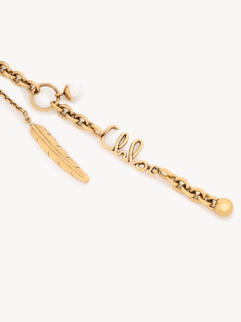 Chlo&eacute; Symbols Flower bag charm in raffia & brass