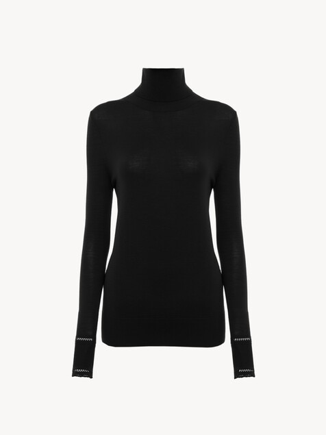 Top ajustado de cuello alto de punto de lana