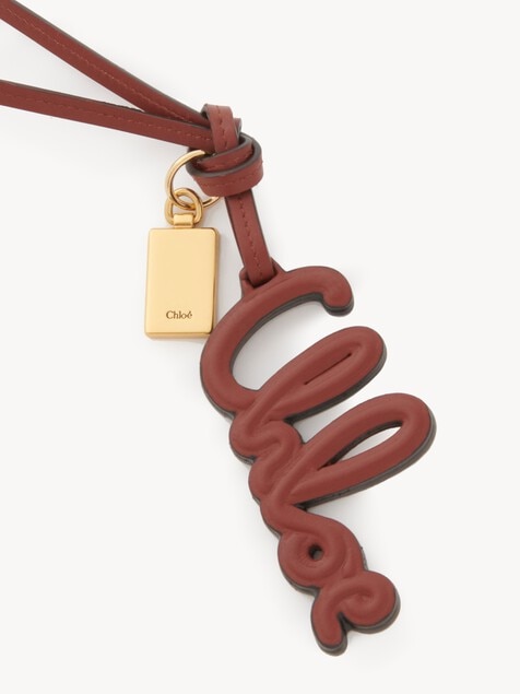 Charm para bolso con logotipo de cuero brillante