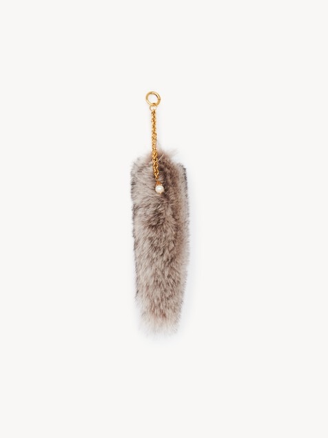 The Treasure Tails charm in shearling