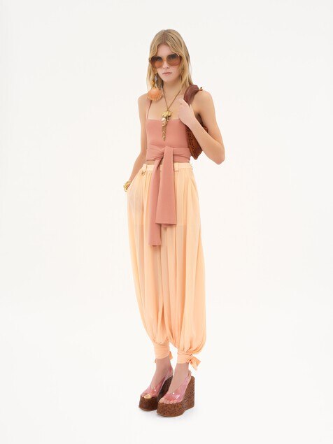 Fluid pleated trousers in silk charmeuse
