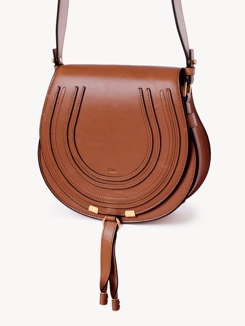Bolso saddle Marcie de cuero brillante