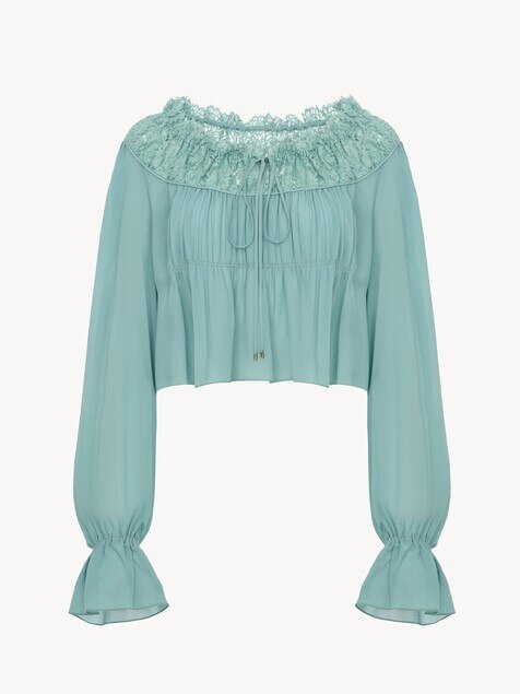 Top cropped de cuello redondo de georgette de seda y encaje