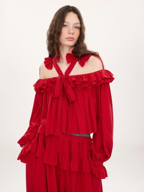 Top con volantes y aberturas de jacquard de seda