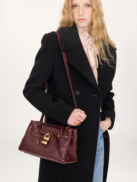 Small Paddington Sling top handle bag in soft leather