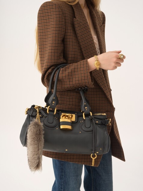 The Treasure Tails charm in shearling