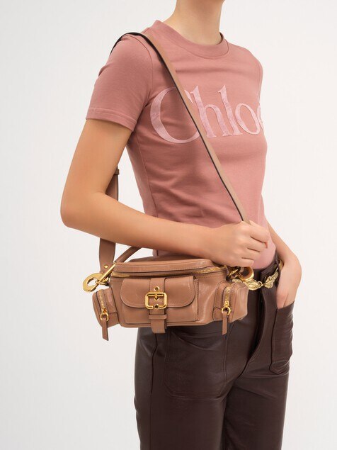 Small camera bag in shiny leather