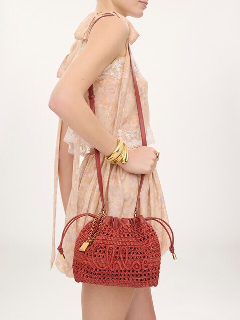 Mini Summer Banana drawstring shoulder bag in raffia
